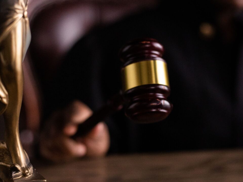 Judge hitting gavel on stand